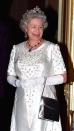 <p>The Queen chose satiny white with elbow-length gloves for a state visit at the French Ambassador's residence.</p>