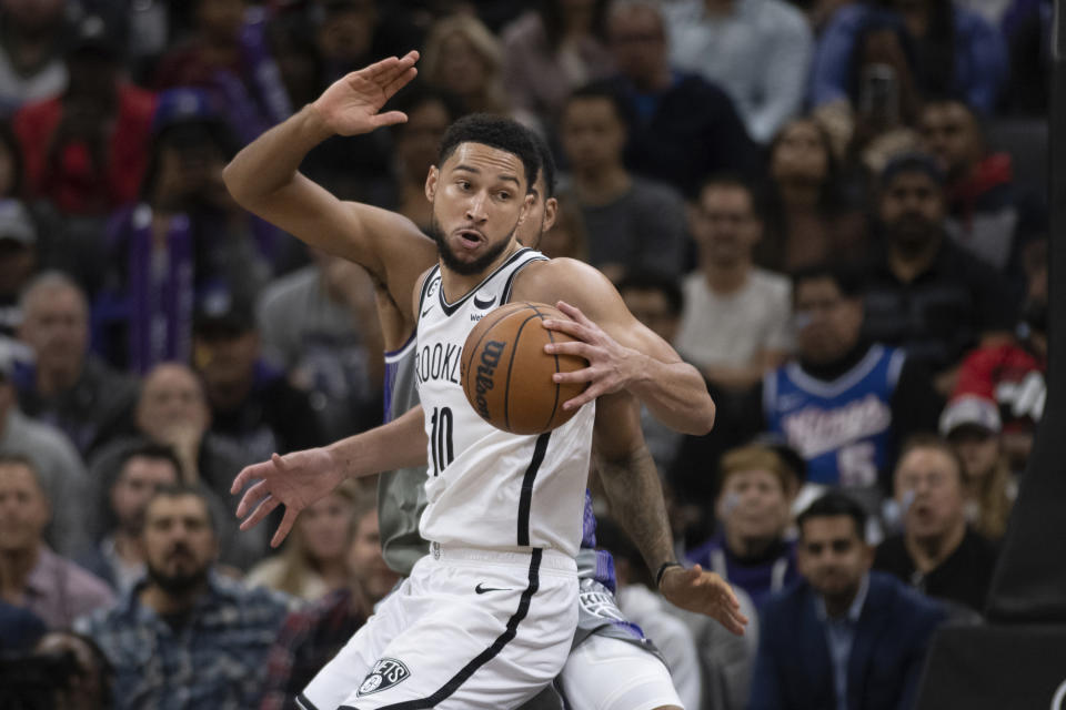 Brooklyn Nets guard Ben Simmons (10) makes a spin move in the key in the second half of an NBA basketball game against the Sacramento Kings in Sacramento, Calif., Tuesday, Nov. 15, 2022. The Kings won 153-121. (AP Photo/José Luis Villegas)