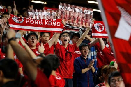 FILE PHOTO: Football Soccer - Hong Kong v Malaysia - AFC Asian Cup Qualifiers - Hong Kong, China October 10, 2017 - Hong Kong fans chant to support their team. REUTERS/Bobby Yip/File Photo