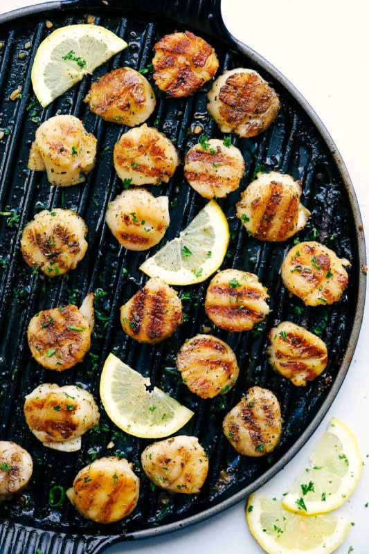 <p>The Recipe Critic</p><p>Grilled lemon garlic scallops is an eloquent dish marinated in the juices of a lemon, a hint of garlic and wrapped in olive oil with Italian seasonings—all grilled to perfection! So simple to make and ready in minutes.</p><p><strong>Get the recipe: <a href="https://therecipecritic.com/grilled-scallops/" rel="nofollow noopener" target="_blank" data-ylk="slk:Grilled Lemon Garlic Scallops;elm:context_link;itc:0;sec:content-canvas" class="link ">Grilled Lemon Garlic Scallops</a></strong></p><p><strong>Related: </strong><strong>21 <a href="https://www.yahoo.com/lifestyle/21-easy-delicious-swordfish-recipes-191734918.html" data-ylk="slk:Savory Swordfish Recipes to Enjoy This Flavorful and Versatile Fish;elm:context_link;itc:0;sec:content-canvas;outcm:mb_qualified_link;_E:mb_qualified_link;ct:story;" class="link  yahoo-link">Savory Swordfish Recipes to Enjoy This Flavorful and Versatile Fish</a></strong></p>