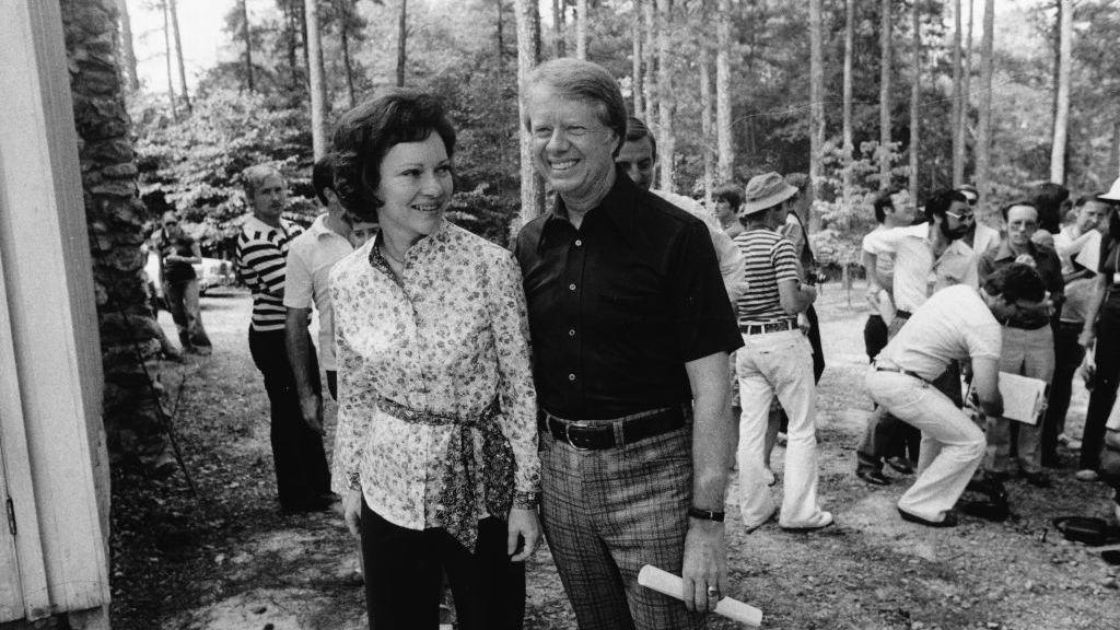 jimmy carter with his wife, rosalynn, after a talk with the press in the woods near his home in plains, georgia