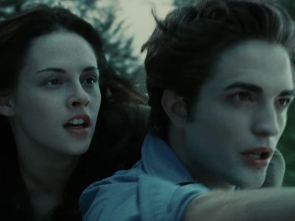 Edward (Robert Pattinson) flies through the air with Bella (Kristen Stewart) on his back in a scene from "Twilight."