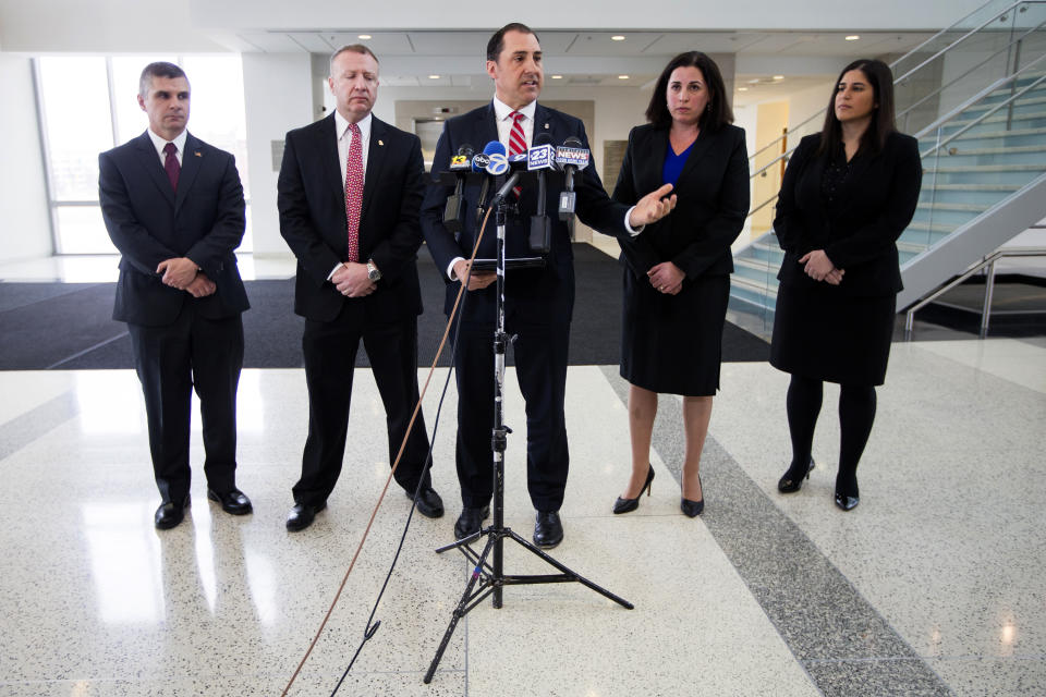 John R. Lausch Jr., U.S. Attorney for the Northern District of Illinois, center, briefs reporters on the trial of Floyd Brown in the killing of Special Deputy United States Marshal Jacob Keltner on Wednesday, March 20, 2019, U.S. District Courthouse in Rockford. Brown pleaded not guilty Wednesday to federal charges accusing him of fatally shooting Keltner, who was trying to serve an arrest warrant at a hotel. (Scott P. Yates/Rockford Register Star via AP)