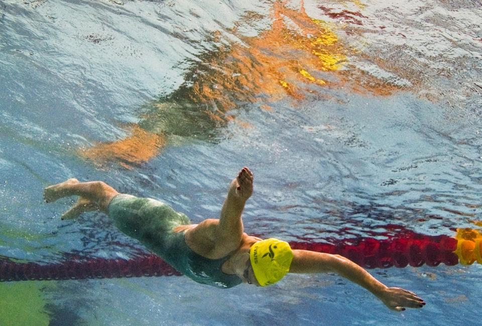 Australian swimmer Blair Evans dives into the pool during a heat for the women's 400 metre individual medley event for The Commonwealth Games at the S.P. Mukherjee Aquatics Centre in New Delhi on October 9, 2010. (FRANCOIS XAVIER MARIT/AFP/Getty Images)