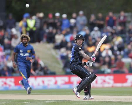 Sri Lankan bowler Lasith Malinga (L) watches as New Zealand captain Brendon McCullum plays to leg gully during their Cricket World Cup match in Christchurch, February 14, 2015. REUTERS/Anthony Phelps