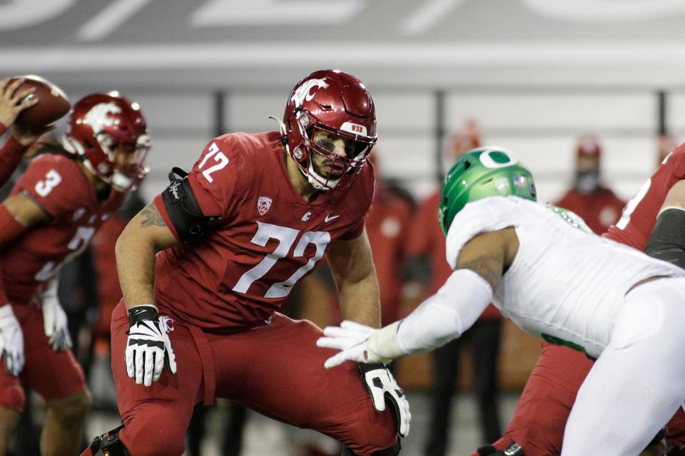 FILE - Washington State offensive lineman Abraham Lucas, left, prepares to block Oregon defensive end Kayvon Thibodeaux during the first half of an NCAA college football game in Pullman, Wash., in this Saturday, Nov. 14, 2020, file photo. Already one of the best pass protectors in the country, Lucas will add to his game with another year in an offense featuring more runs and tighter line splits. (AP Photo/Young Kwak, File)