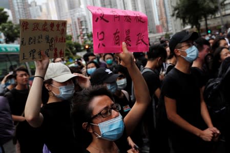 Supporters gather outside the Eastern Courts to support the arrested anti-extradition bill protesters who face rioting charges, in Hong Kong