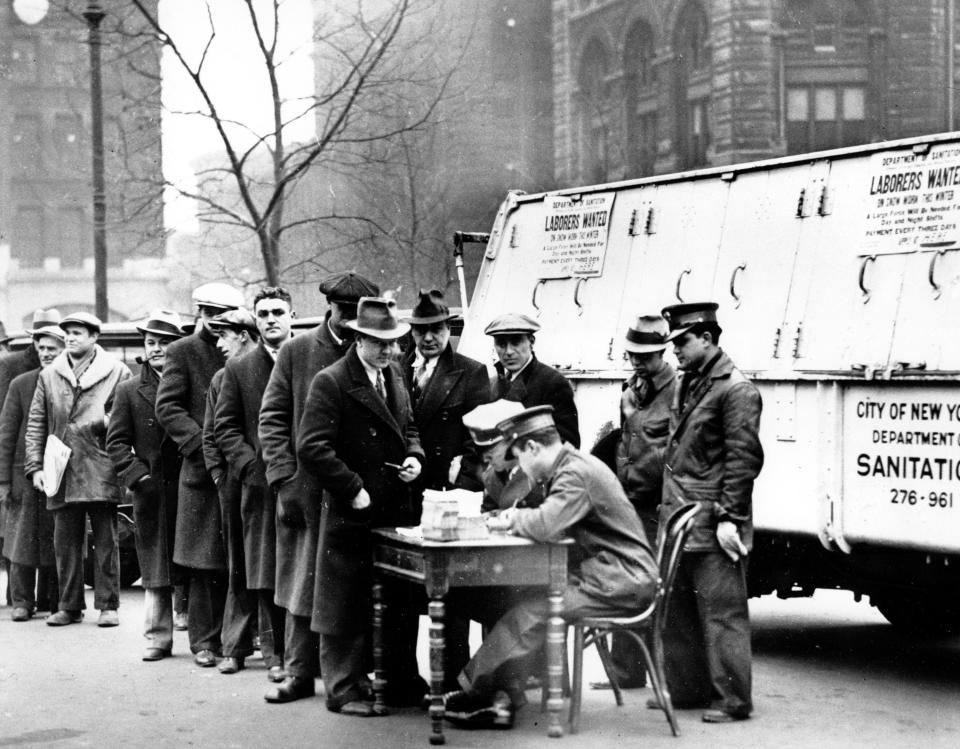 Men line up in front of City Hall to apply for jobs cleaning away snow in New York City on Jan. 3, 1934, around the height of the Great Depression.