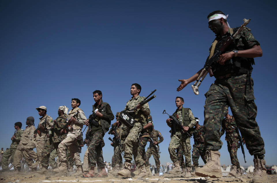 FILE - This Jan. 3, 2017 file photo, newly recruited Shiite fighters, known as Houthis, march during a gathering aimed at mobilizing more fighters into battlefronts to fight pro-government forces in several Yemeni cities, in Sanaa, Yemen. From Lebanon and Syria to Iraq, Yemen, and the Gaza Strip, Iran has significantly expanded its footprint over the past decade, finding and developing powerful allies in conflict-ravaged countries across the Middle East. Iran supports the Houthis but denies arming them. (AP Photo/Hani Mohammed, File)