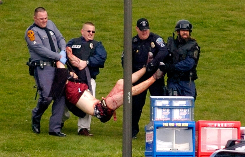 Student Kevin Sterne, is carried out of Norris Hall at Virginia Tech in Blacksburg, Va. in this April 16, 2007 photo. Sterne was one of the wounded students who survived the mass shooting on April 16. | Alan Kim—The Roanoke Times/AP