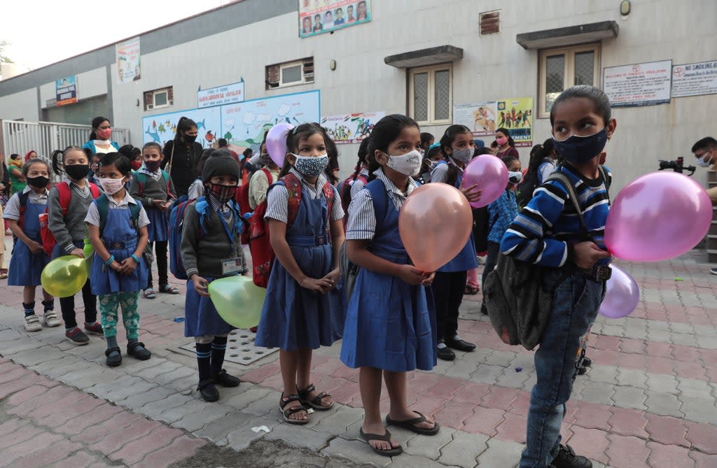 File: Indian primary school students at their first day of school after Covid restrictions were eased   (EPA)