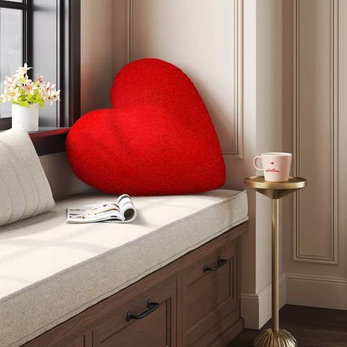 the pillow in red in a sitting area