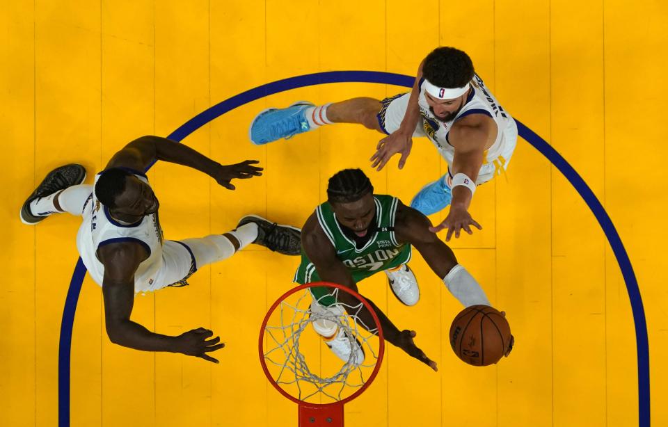 Boston Celtics guard Jaylen Brown goes to the basket past Golden State Warriors guard Klay Thompson (11) during the second half in game one of the 2022 NBA Finals at Chase Center on Jun 2, 2022.