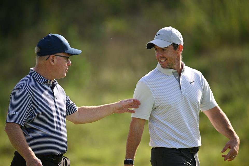 Rory McIlroy of Northern Ireland talks with Keith Pelley, CEO of the DP World Tour (Getty Images)
