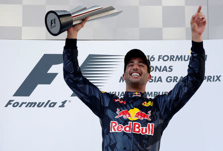 Formula One - F1 - Malaysia Grand Prix - Sepang, Malaysia- 2/10/16 Red Bull's Daniel Ricciardo of Australia celebrates on the podium. REUTERS/Edgar Su