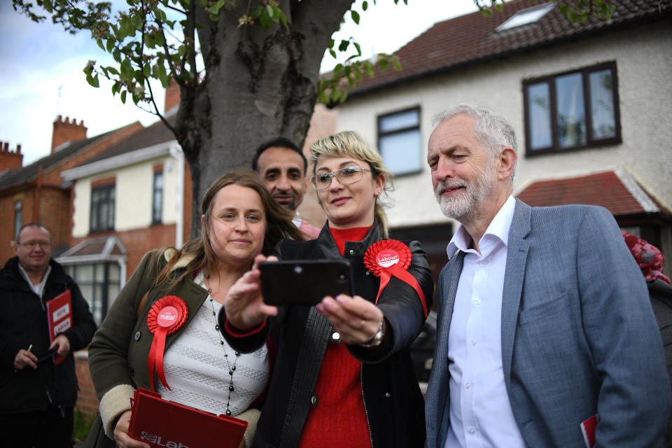 Labour leader Jeremy Corbyn poses for a selfie with Lucinda Robinson, Shaz Nawaz and Katia Yurgutene during campaigning in Peterborough ahead of next week's local elections.