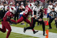 Atlanta Falcons quarterback Desmond Ridder (9) scores a touchdown against the Arizona Cardinals during the second half of an NFL football game, Sunday, Nov. 12, 2023, in Glendale, Ariz. (AP Photo/Ross D. Franklin)