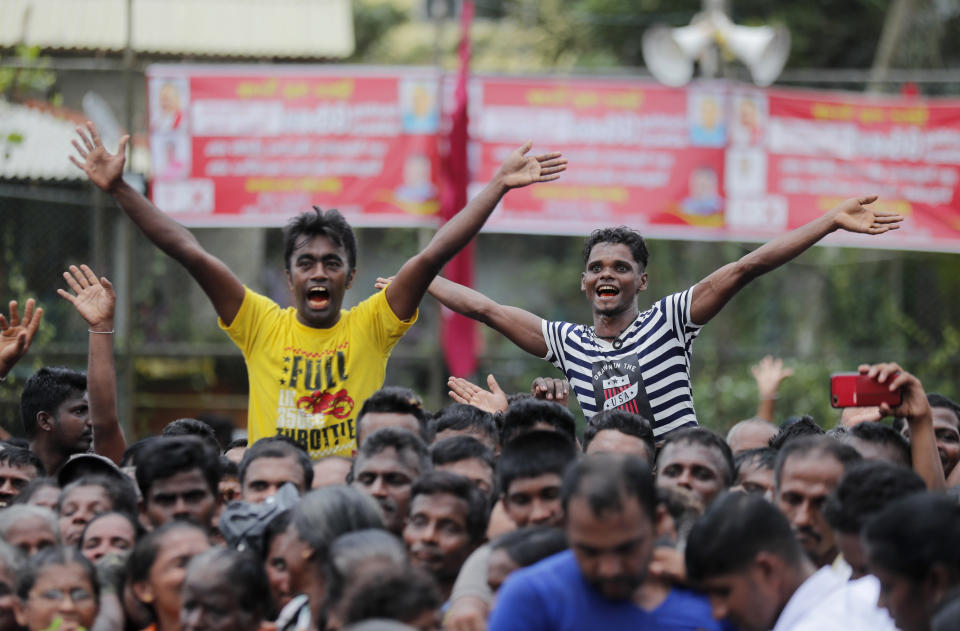 Supporters of Sri Lankan presidential candidate and former defense chief Gotabaya Rajapaksa cheer during a rally in Neluwa village in Galle, Sri Lanka, Tuesday, Oct. 22, 2019. Rajapaksa is the front-runner in Sri Lanka's upcoming presidential election. (AP Photo/Eranga Jayawardena)