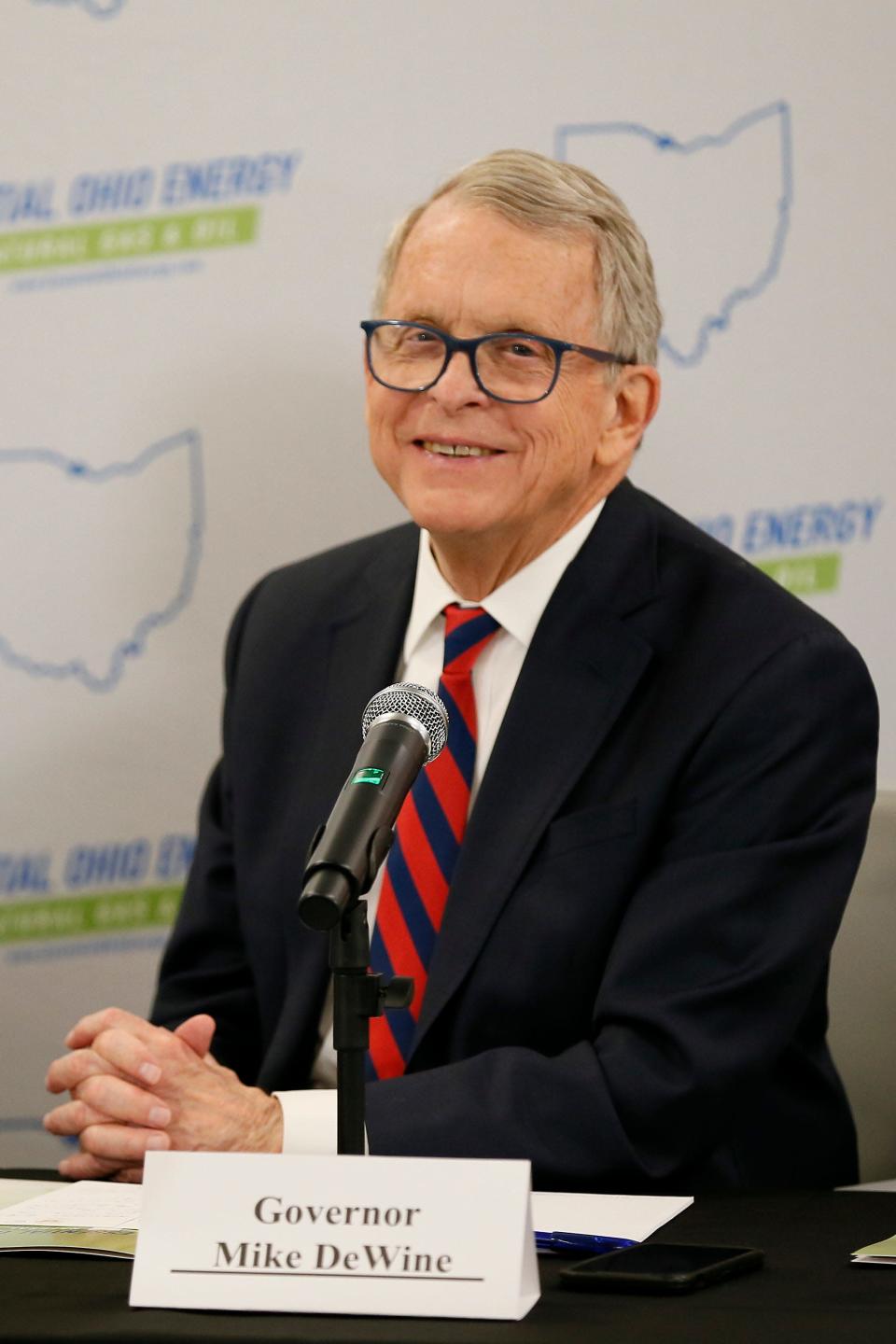 Ohio governor Mike Dewine smiles during a brief on-camera appearance before a round table discussion with members of Ohio’s natural gas and oil industry at Enerfab in the Winton Place neighborhood of Cincinnati on Thursday, June 16, 2022.