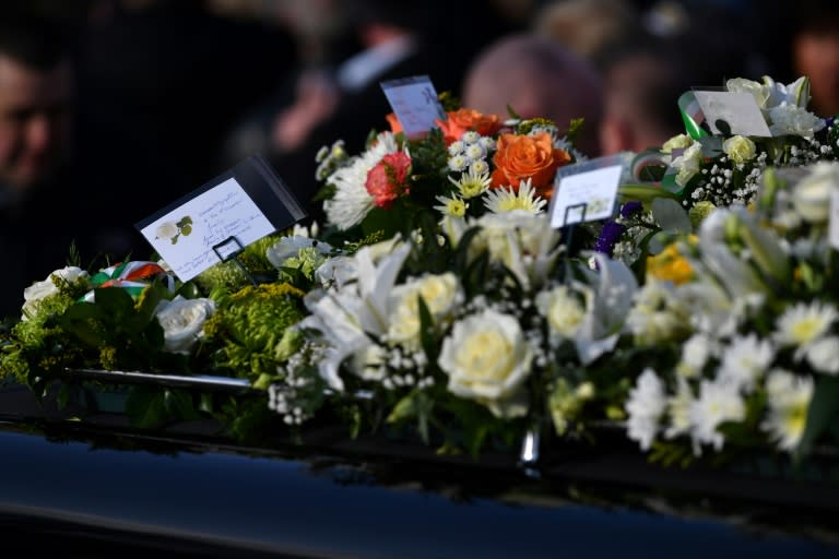 Flowers are seen on the hearse outside St Columba's Church Long Tower after the funeral of former Northern Ireland Deputy First Minister Martin McGuinness in Derry, Northern Ireland on March 23, 2017