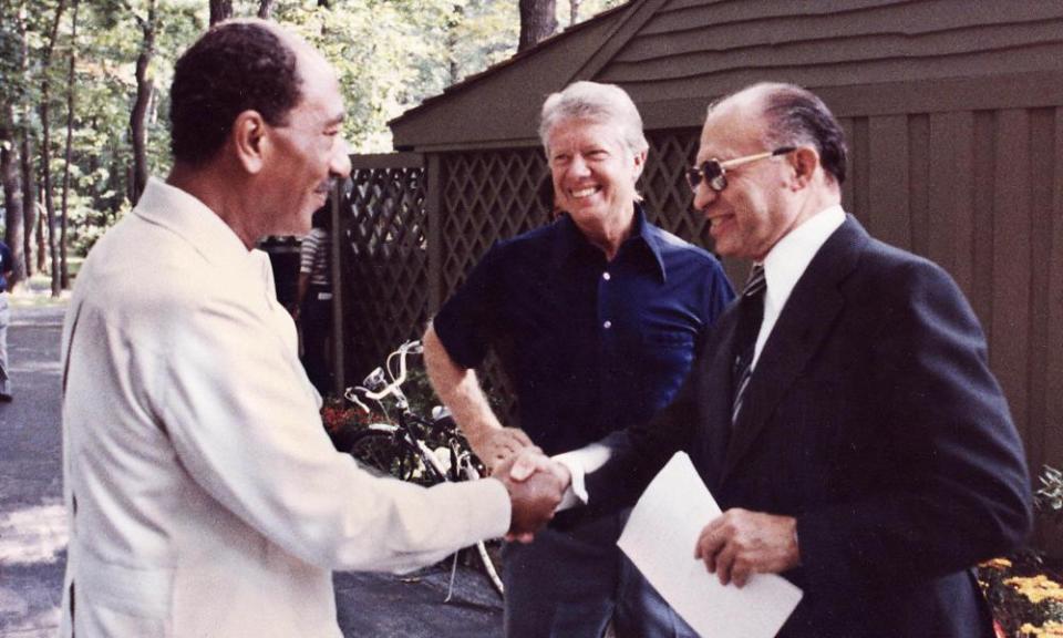 President Anwar Sadat of Egypt, left, shaking hands with Israeli Prime Minister Menachem of Israel, with Jimmy Carter looking on at the US presidential retreat at Camp David in 1978, before the announcement of the historic peace accords the following year.