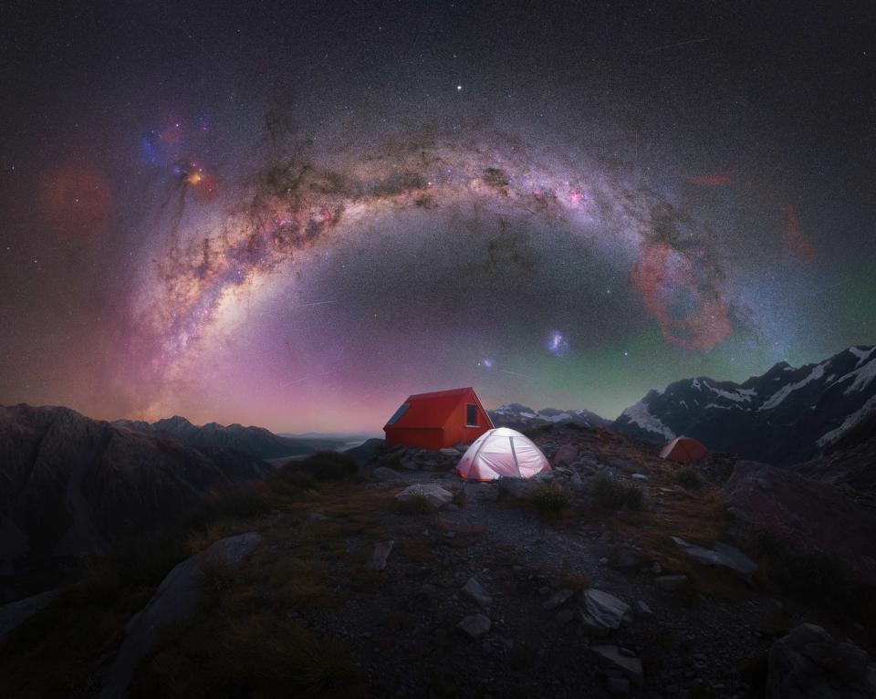 Milky way arc photographed above a lone camping tent on top of Aoraki/Mt Cook National Park, New Zealand