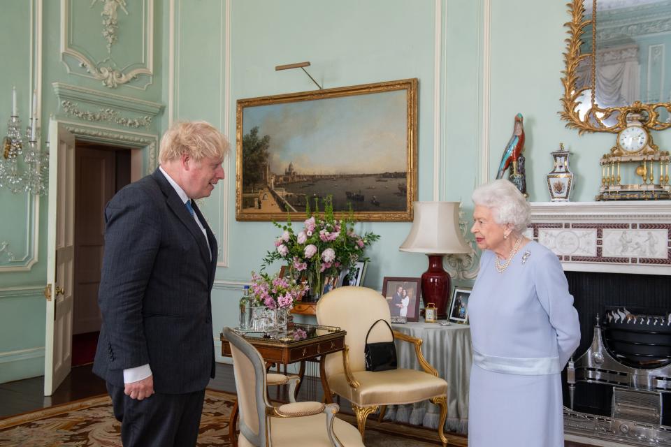 The Queen greets Boris Johnson at Buckingham Palace on Wednesday (PA)