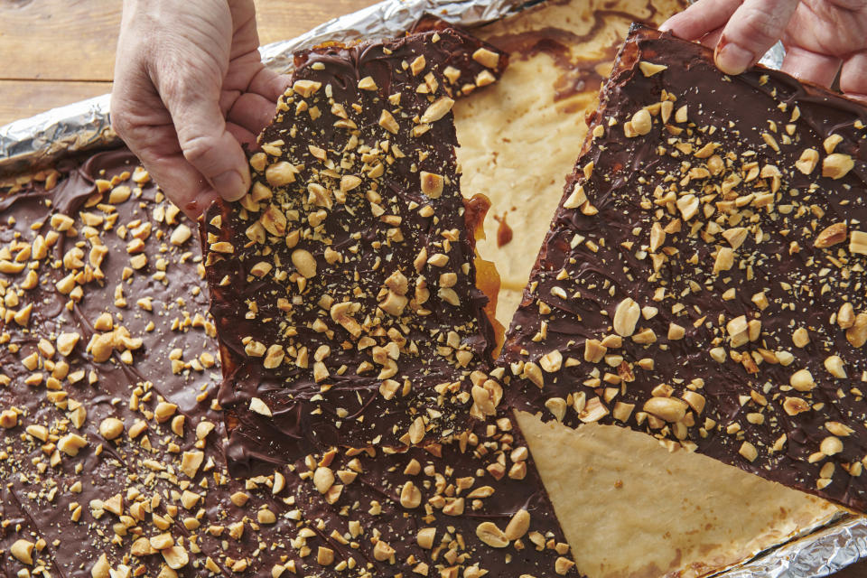 This photo shows chocolate toffee covered matzoh. Chocolate-covered caramel matzo, also known as Matzoh Buttercrunch, has become a popular Passover dessert. (Cheyenne Cohen via AP).