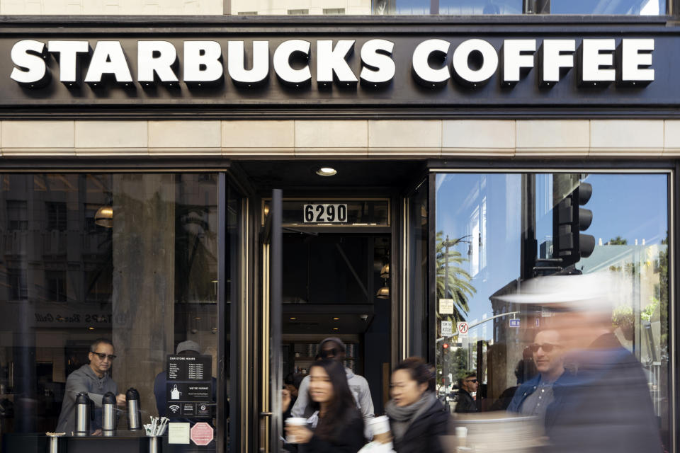 Pedestrians walk by a Starbucks Coffee shop in Los Angeles, California on February 6, 2019. (Photo by Ronen Tivony)