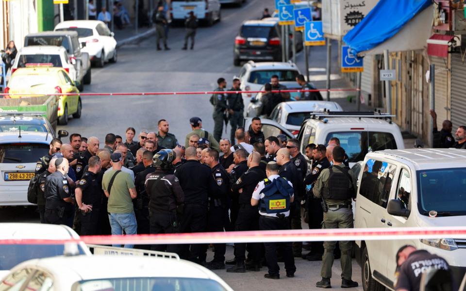 Israeli officials work at the scene of an incident in Jerusalem