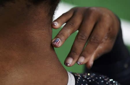The fingers of Simone Biles during the women's team final. REUTERS/Dylan Martinez