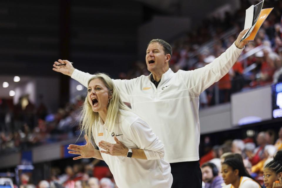 Tennessee head coach Kellie Harper, left, and assistant coach Joh Harper, right, shout towards the court during the second half of a first-round college basketball game against Green Bay in the NCAA Tournament in Raleigh, N.C., Saturday, March 23, 2024. (AP Photo/Ben McKeown)