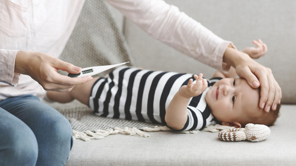 The U.S. Centers for Disease Control and Prevention says fever, upper respiratory tract infection and rash are common symptoms of parechovirus in children. (Photo via Getty Images)