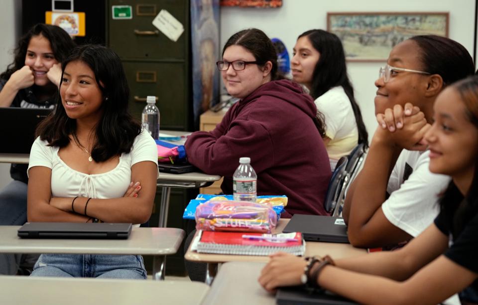 Central Falls High School students listen to Soljane Martinez during Brown's Law and Literature class. “For a lot of these students," she said, "they go to school a few blocks away and they’ve never experienced campus."