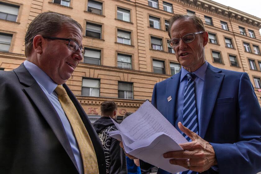 LOS ANGELES, CA - SEPTEMBER 15: Mark Dyer, left, VP of Operations, Corporate Real Estate & Housing, and AHF President Michael Weinstein at the opening of a newly renovated old Leland Hotel building that is converted into an affordable rental housing units by AIDS Healthcare Foundation announced (AHF) in Skid Row on 116 E. 5th Street in Los Angeles, CA. (Irfan Khan / Los Angeles Times)