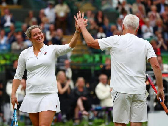 Kim Clijsters helped open the new roof on the No.1 Court at Wimbledon alongside John McEnroe (Getty)