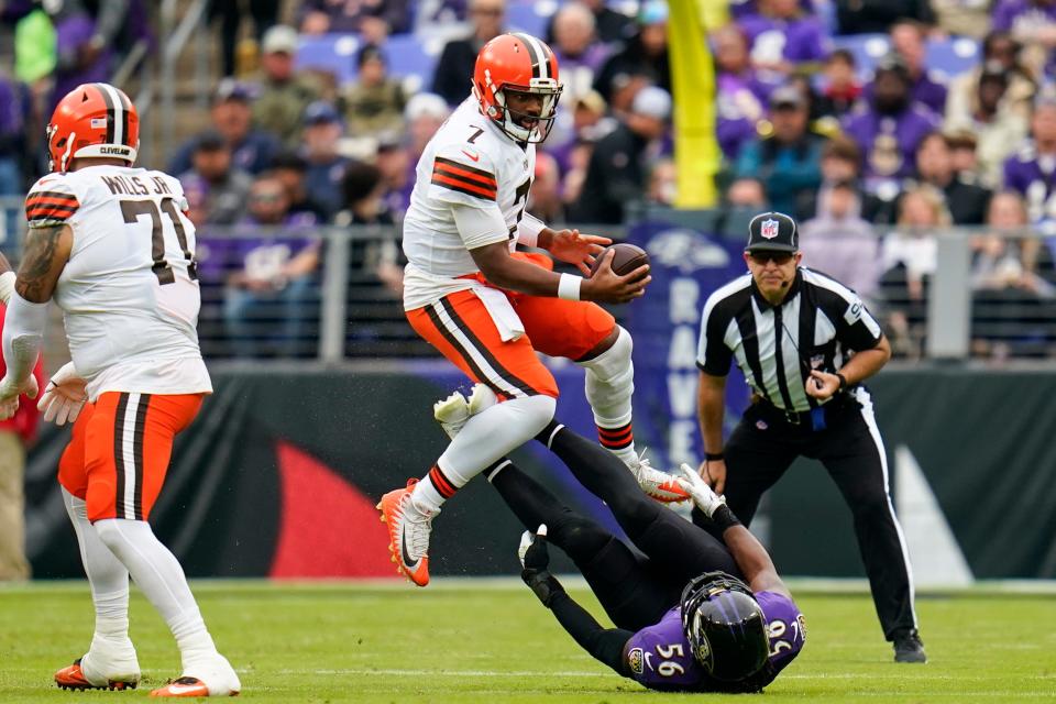 Cleveland Browns quarterback Jacoby Brissett (7) avoids Baltimore Ravens linebacker Josh Bynes (56) in the second half of an NFL football game, Sunday, Oct. 23, 2022, in Baltimore. (AP Photo/Julio Cortez)