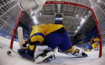 Ice Hockey - Pyeongchang 2018 Winter Olympics - Men's Quarterfinal Match - Sweden v Germany - Kwandong Hockey Centre, Gangneung, South Korea - February 21, 2018 - Patrick Reimer of Germany scores their fourth goal to win the match. REUTERS/Kim Kyung-Hoon