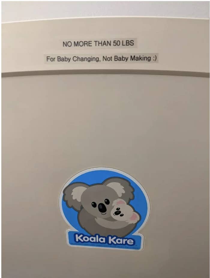 A label on a baby changing table says "No more than 50 pounds, for baby changing, not baby making"