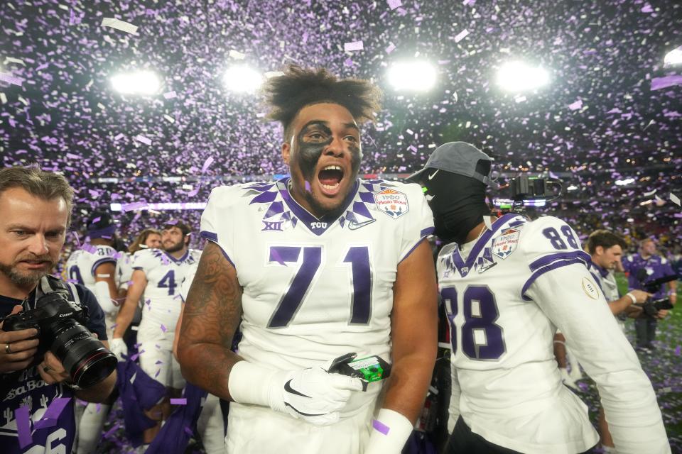 TCU offensive lineman Marcus Williams (71) celebrates after the Horned Frogs defeated Michigan in the 2022 Fiesta Bowl at State Farm Stadium.