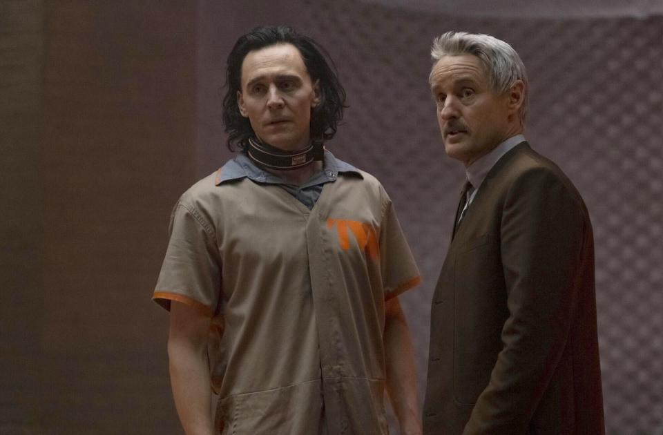 Tom Hiddleston and Owen Wilson stand inside a prison