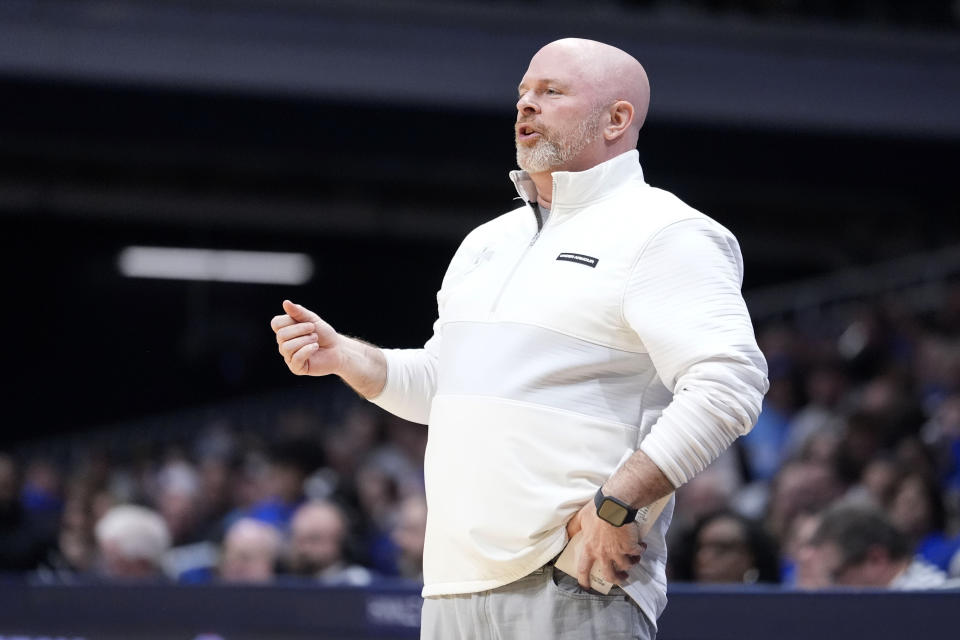 Indiana State head coach Josh Schertz watches from the bench during the first half of an NCAA college basketball game against Seton Hall for the championship of the NIT, Thursday, April 4, 2024, in Indianapolis. (AP Photo/Michael Conroy)