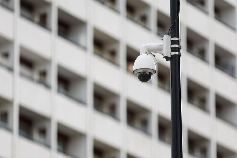 A CCTV camera is seen near residential apartment buildings in Epinay-sous-Senart near Paris