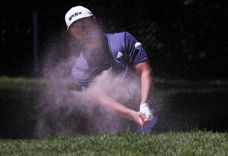 Jon Rahm hits from a sand trap on the first day of competition of the WGC-Mexico Championship at the Chapultepec Golf Club in Mexico City, Thursday, Feb. 21, 2019. (AP Photo/Marco Ugarte)