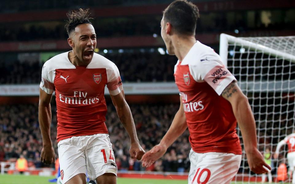 Pierre-Emerick Aubameyang celebrates after being teed up by Mesut Ozil - Getty Images Europe