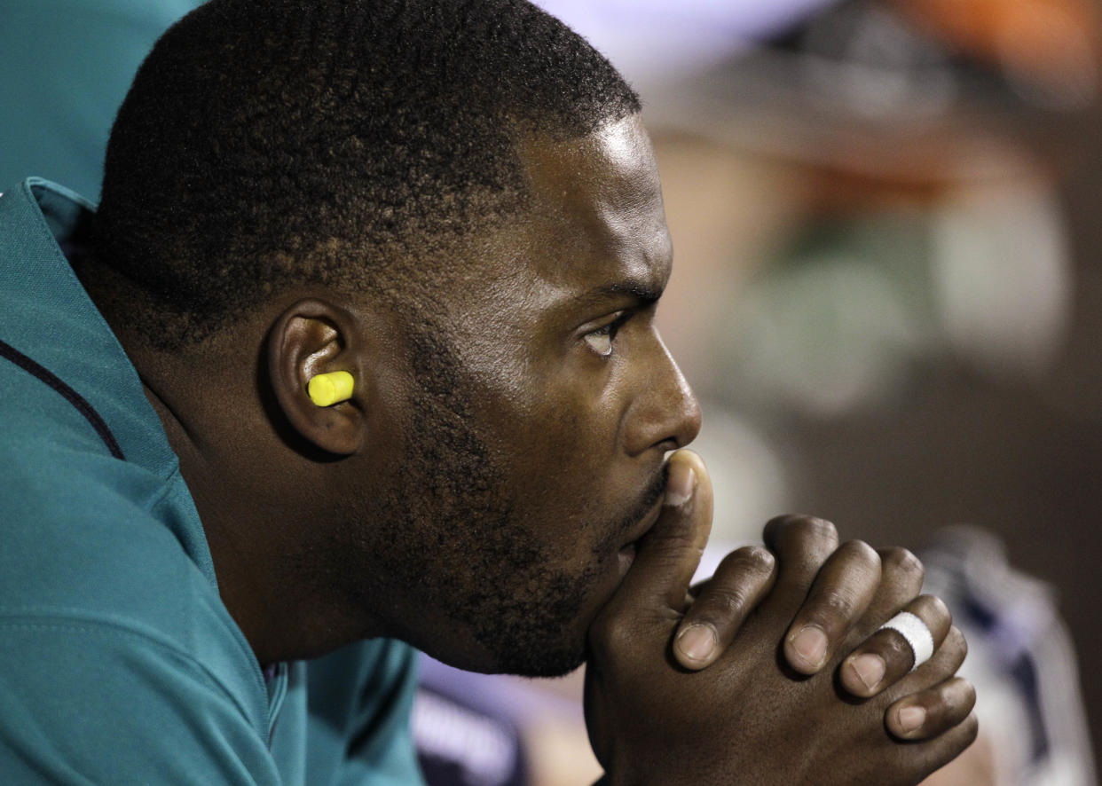 Milton Bradley has been charged with spousal battery. (AP Photo/Elaine Thompson)