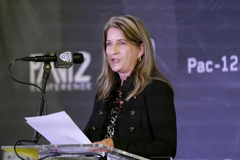 FILE - Pac-12 Senior Associate Commissioner Teresa Gould speaks during the conference's basketball media day Oct. 12, 2021, in San Francisco. Gould later became commissioner of the conference. The NCAA and the nation's five biggest conferences have agreed to pay nearly $2.8 billion to settle a host of antitrust claims,a monumental decision that sets the stage for a groundbreaking revenue-sharing model that could start directing millions of dollars directly to athletes as soon as the 2025 fall semester.(AP Photo/Jeff Chiu, File)