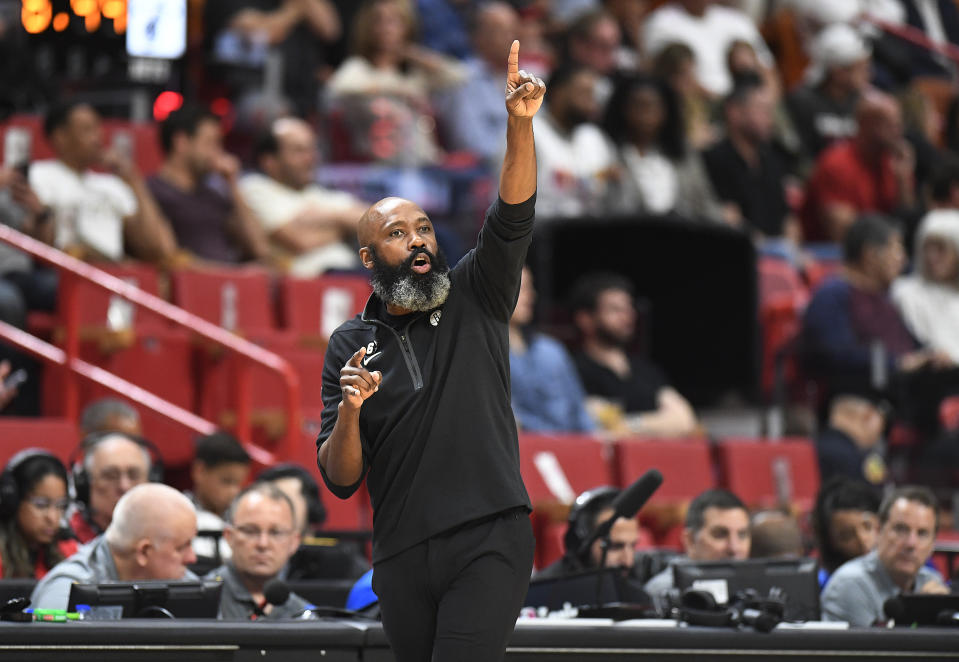 Brooklyn Nets coach Jacque Vaughn instructs his players against the Miami Heat during the first half of an NBA basketball game, Saturday, March 25, 2023, in Miami, Fla. (AP Photo/Michael Laughlin)