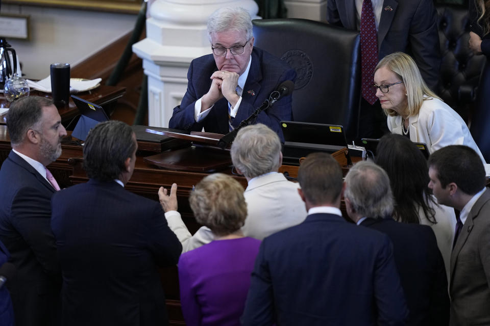 Texas Lt. Gov. Dan Patrick, top center, talks with counsel during day four of the impeachment trial for Texas Attorney General Ken Paxton in the Senate Chamber at the Texas Capitol, Friday, Sept. 8, 2023, in Austin, Texas. (AP Photo/Eric Gay)