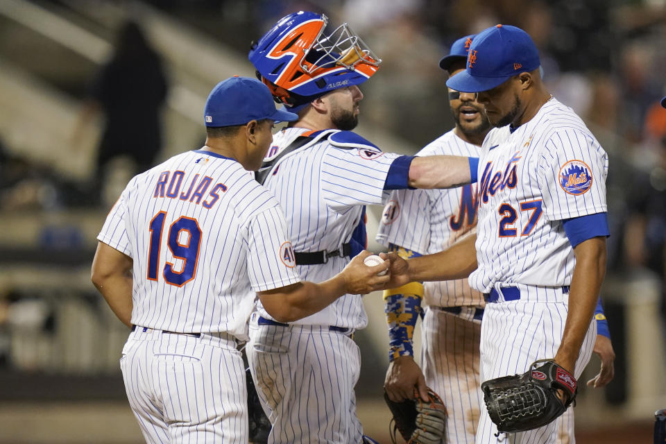 New York Mets manager Luis Rojas (19) takes the ball from relief pitcher Jeurys Familia (27) during the eighth inning of the team's baseball game against the St. Louis Cardinals on Tuesday, Sept. 14, 2021, in New York. (AP Photo/Frank Franklin II)